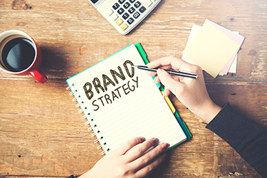 woman written brand strategy text