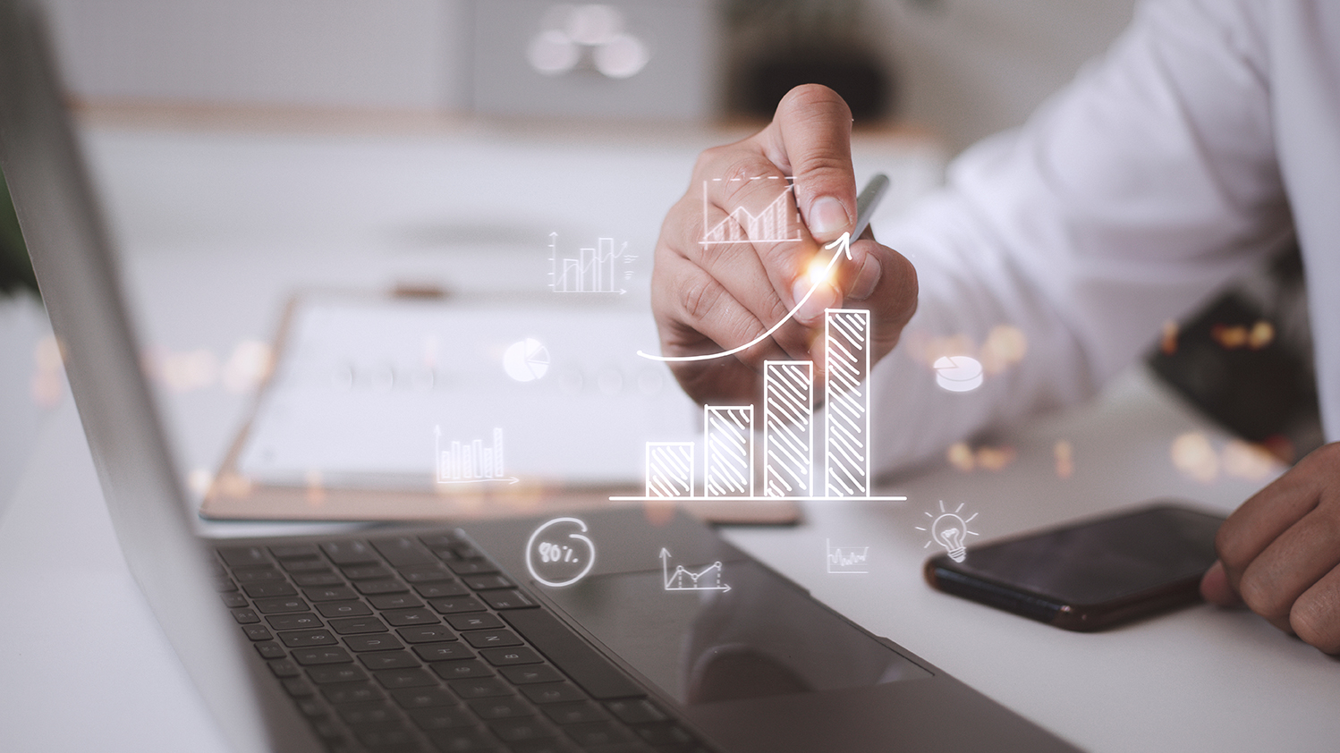 businessman draws an increasing trend arrow and a rising chart f